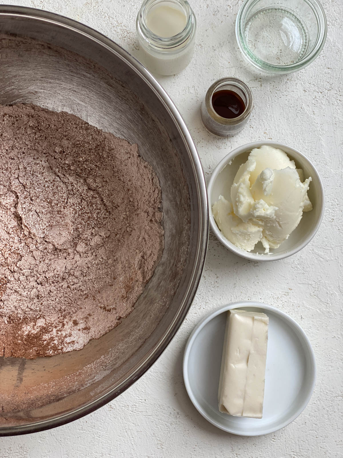 ingredients for Vegan Chocolate Frosting measured out against a white surface