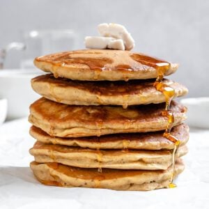 completed stack of Vegan Pumpkin Pancakes against a white background