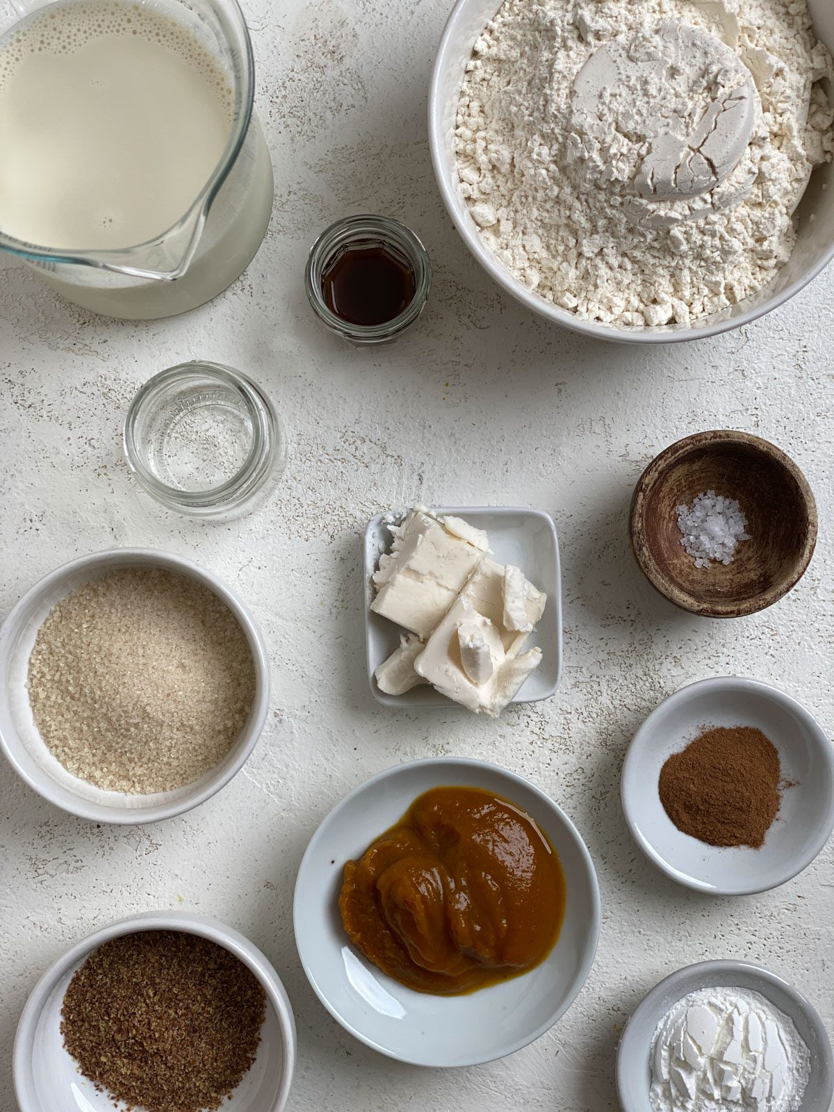 ingredients for Vegan Pumpkin Pancakes measured out against a white surface