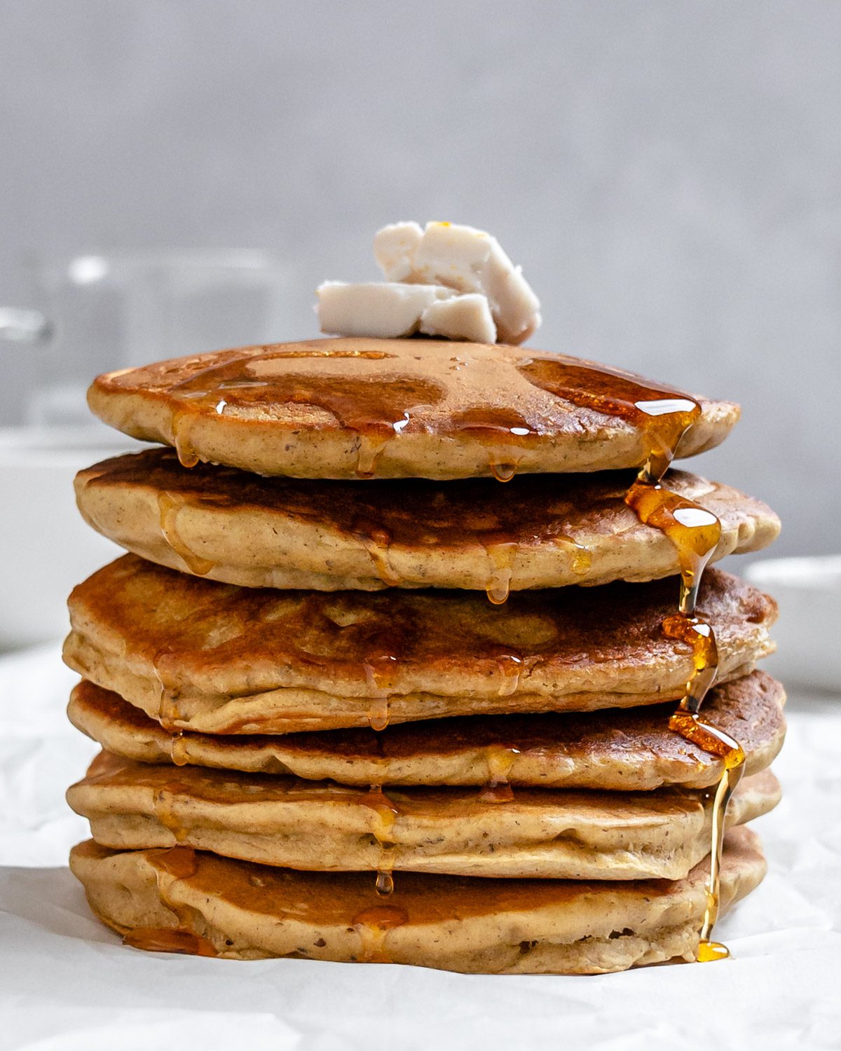 completed stack of Vegan Pumpkin Pancakes against a white background
