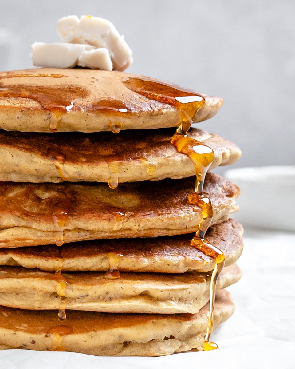 completed stack of Vegan Pumpkin Pancakes against a white background