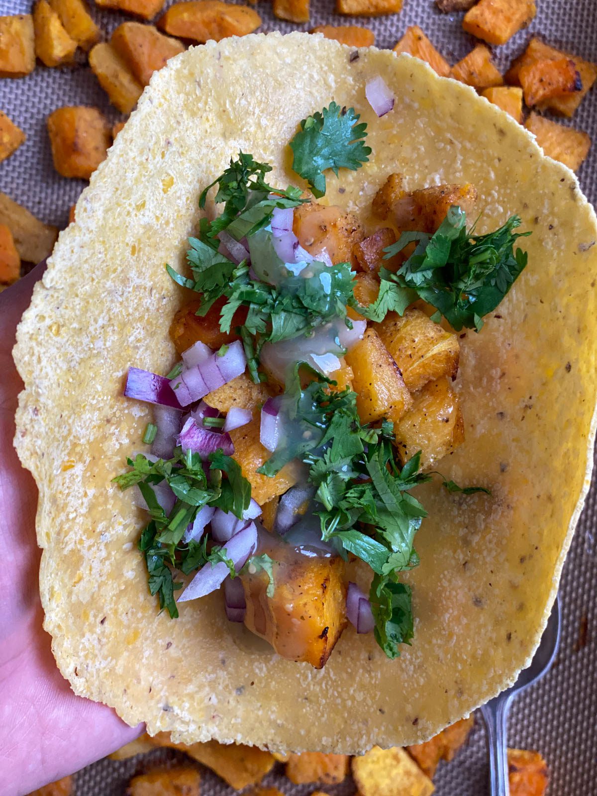 process shot of adding filling to tortilla