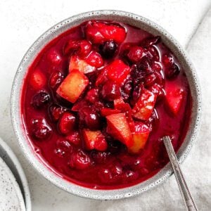 completed Easy Cranberry Pear Sauce in a bowl against a white surface