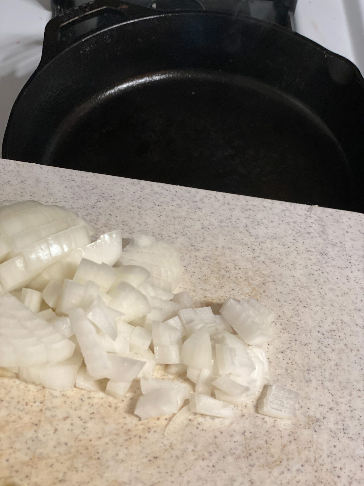 sliced onions on cutting board