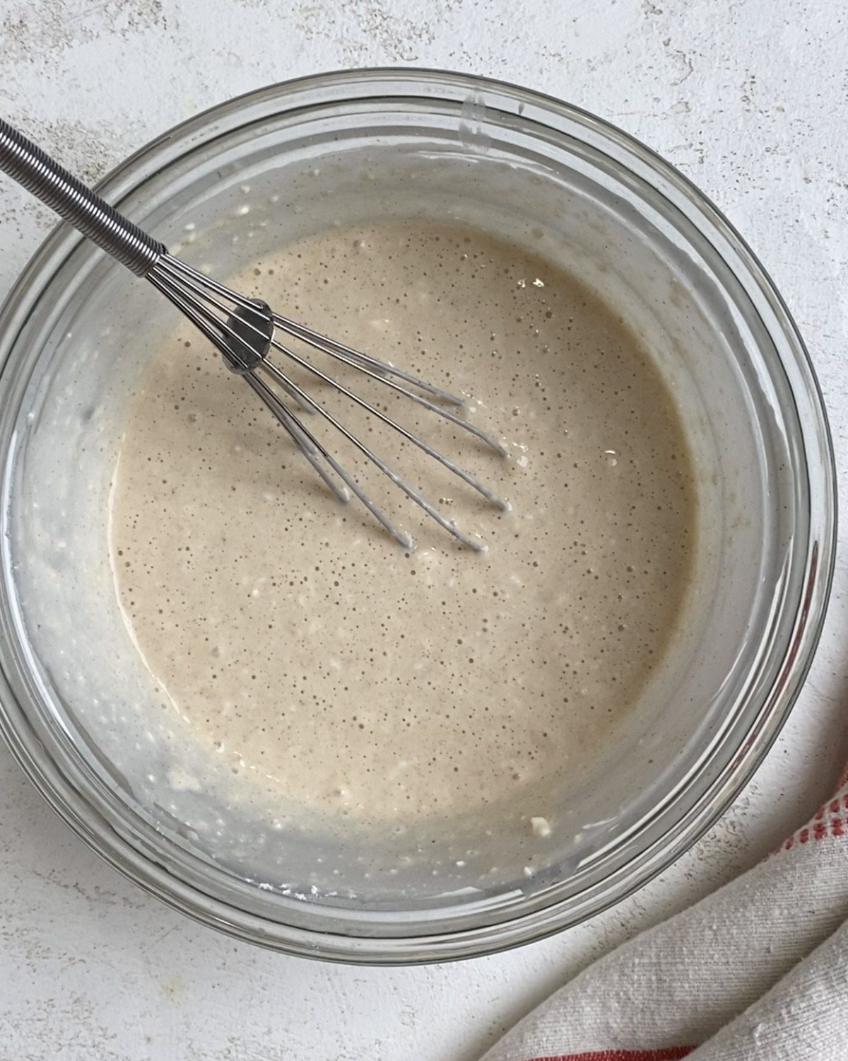 process of mixing ingredients together in bowl