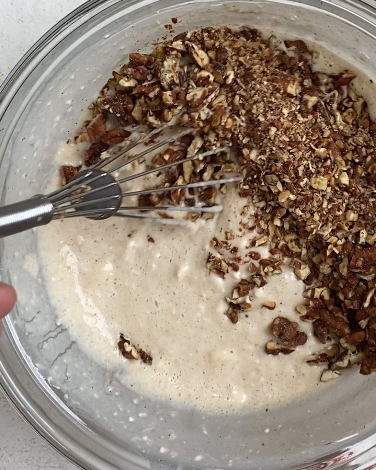 process of mixing pecans in flour mixture