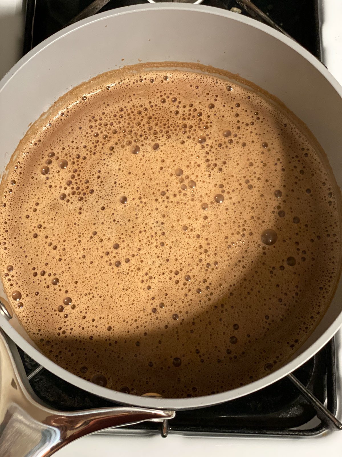 process shot of mixing ingredients together in a pot