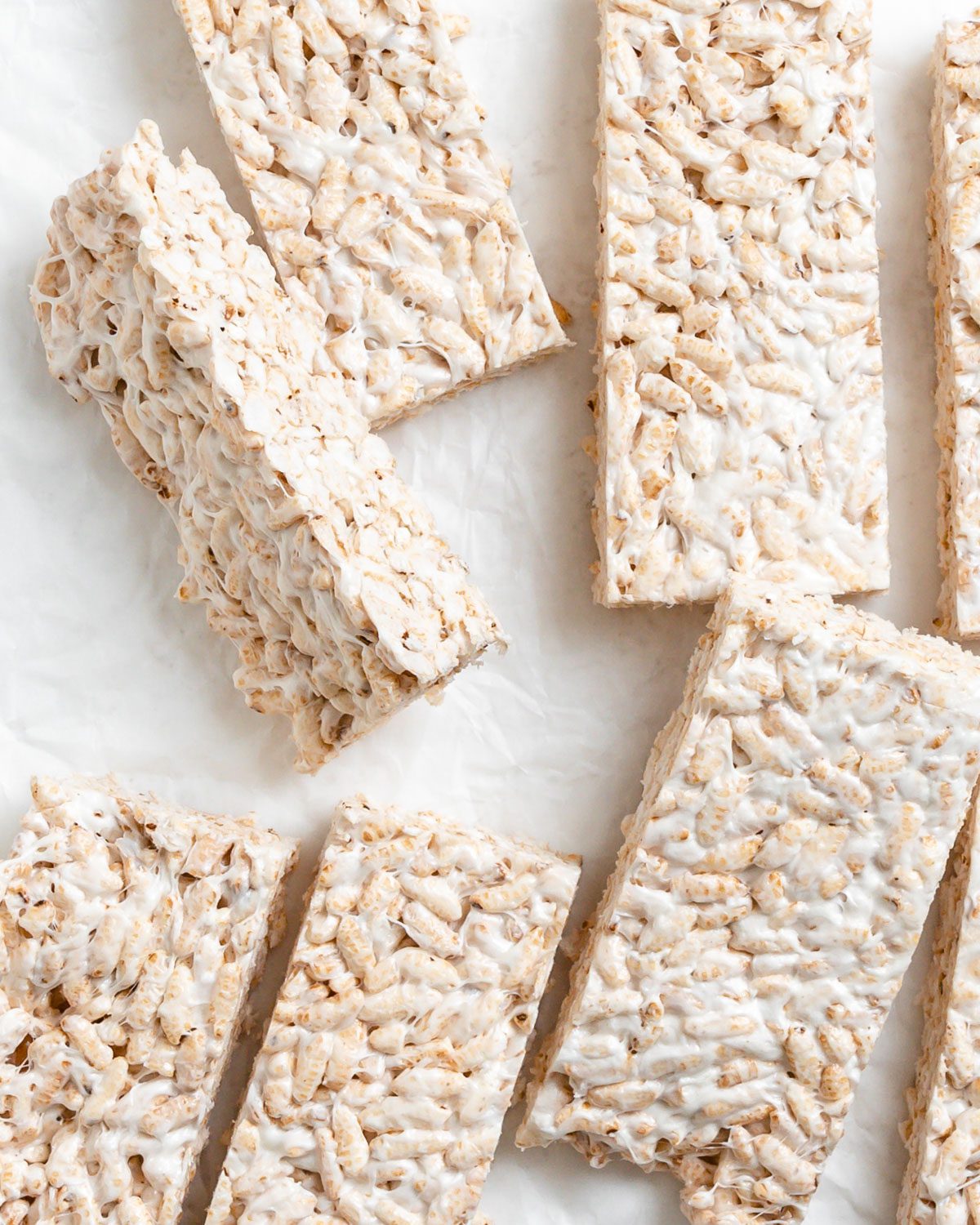 completed Easy Vegan Rice Krispie Treats scattered on a white surface