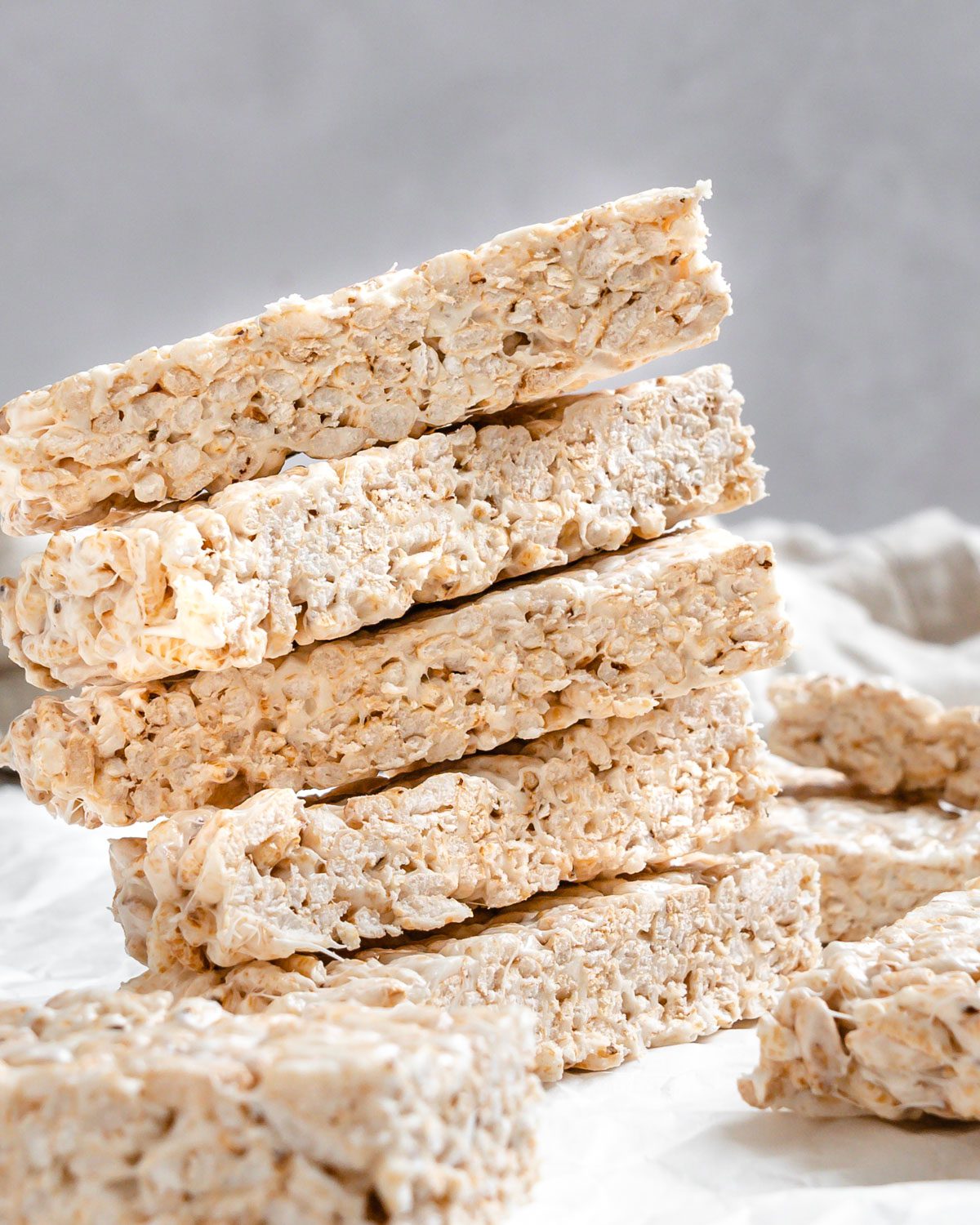 completed Easy Vegan Rice Krispie Treats scattered on a white surface