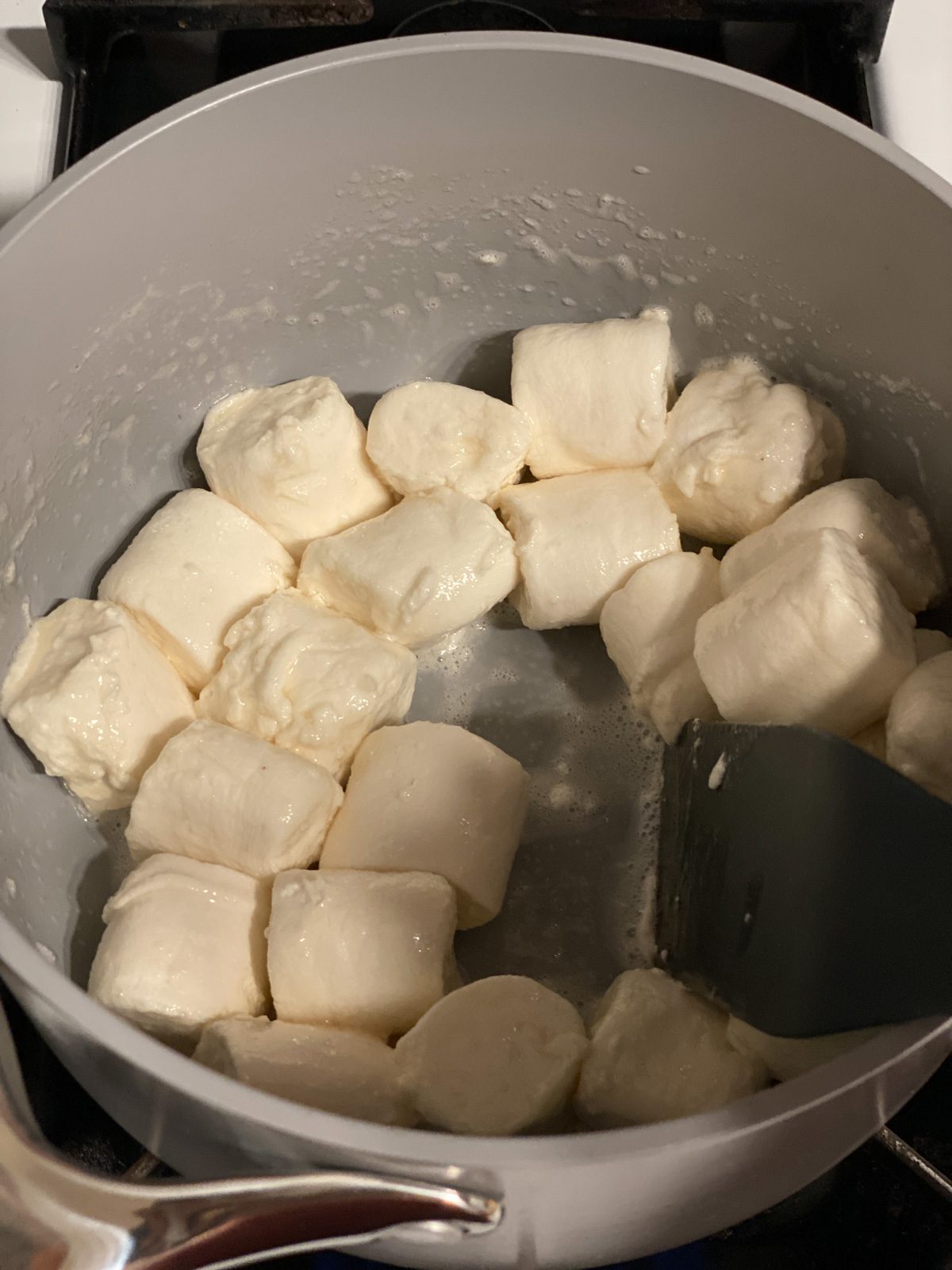 process shot of mixing ingredients in pan