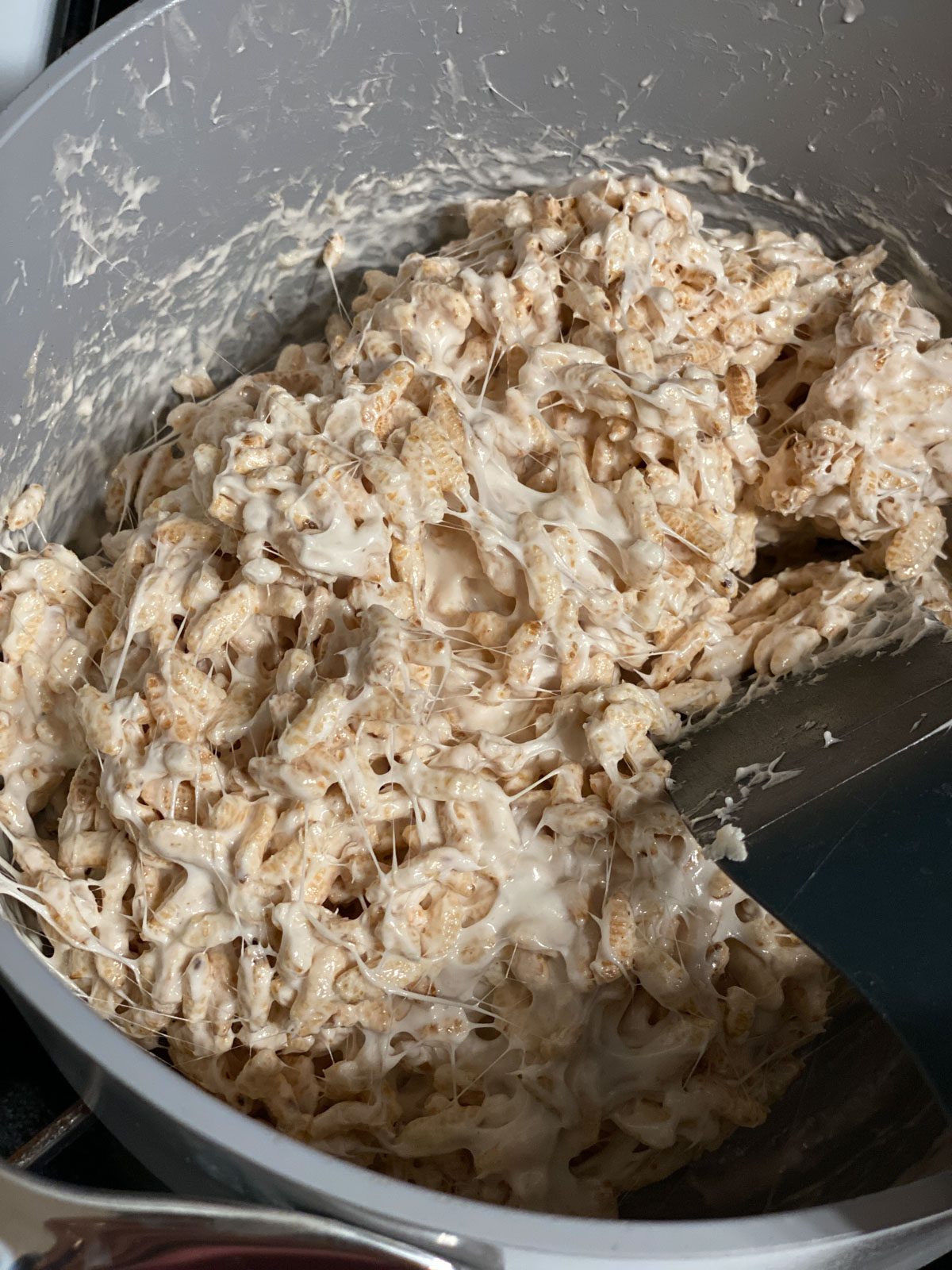 process shot of mixing ingredients in pan