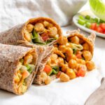 completed Buffalo Chickpea Wraps on a white surface