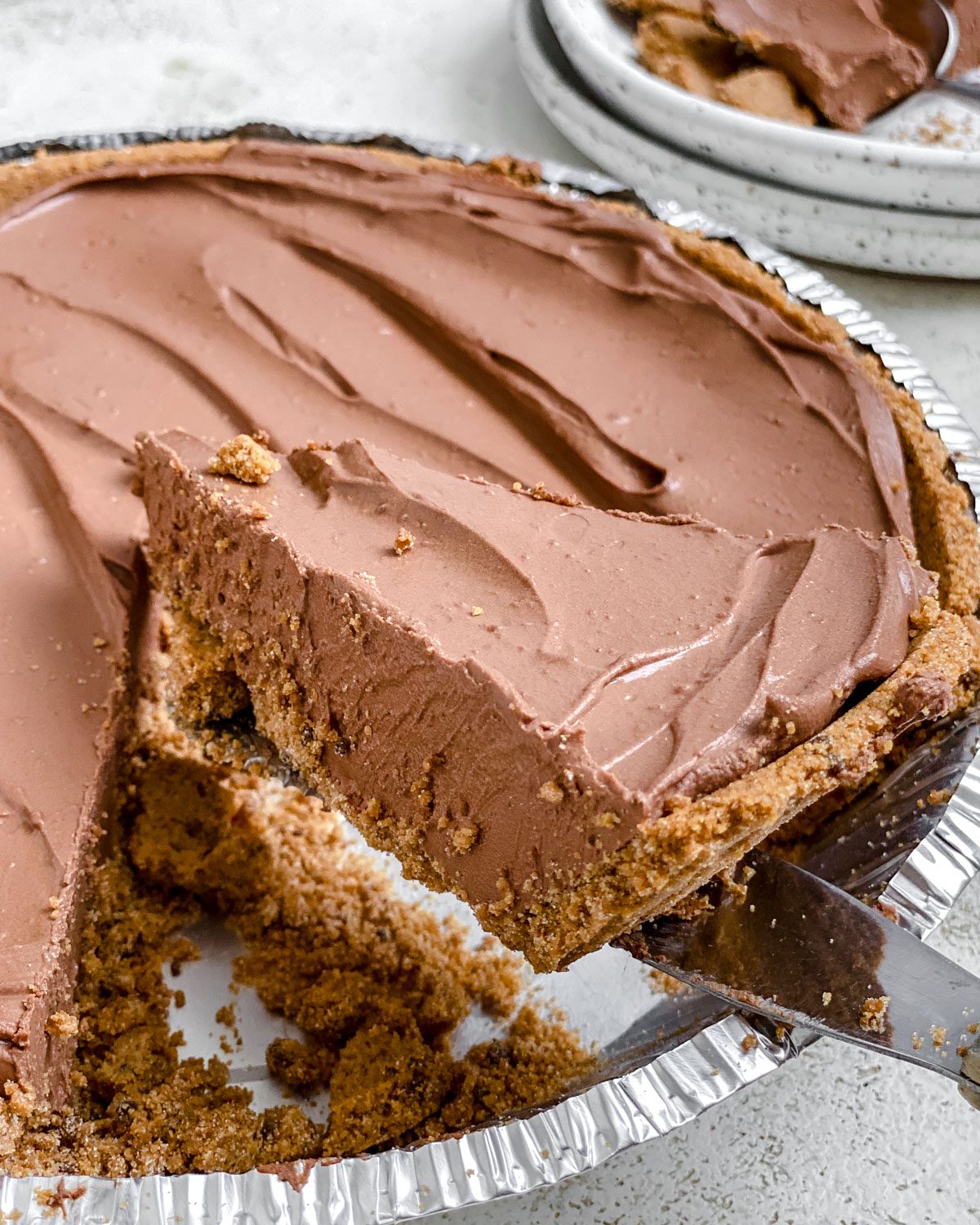 completed close up of a piece of Easy Vegan Chocolate Peanut Butter Pie