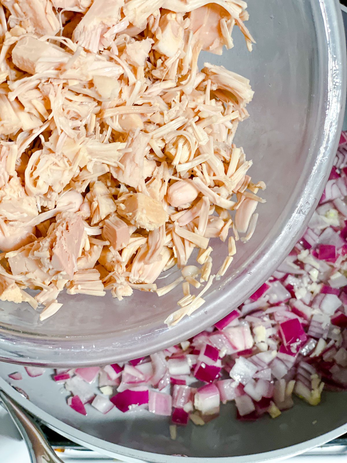 process of adding jackfruit to a pan