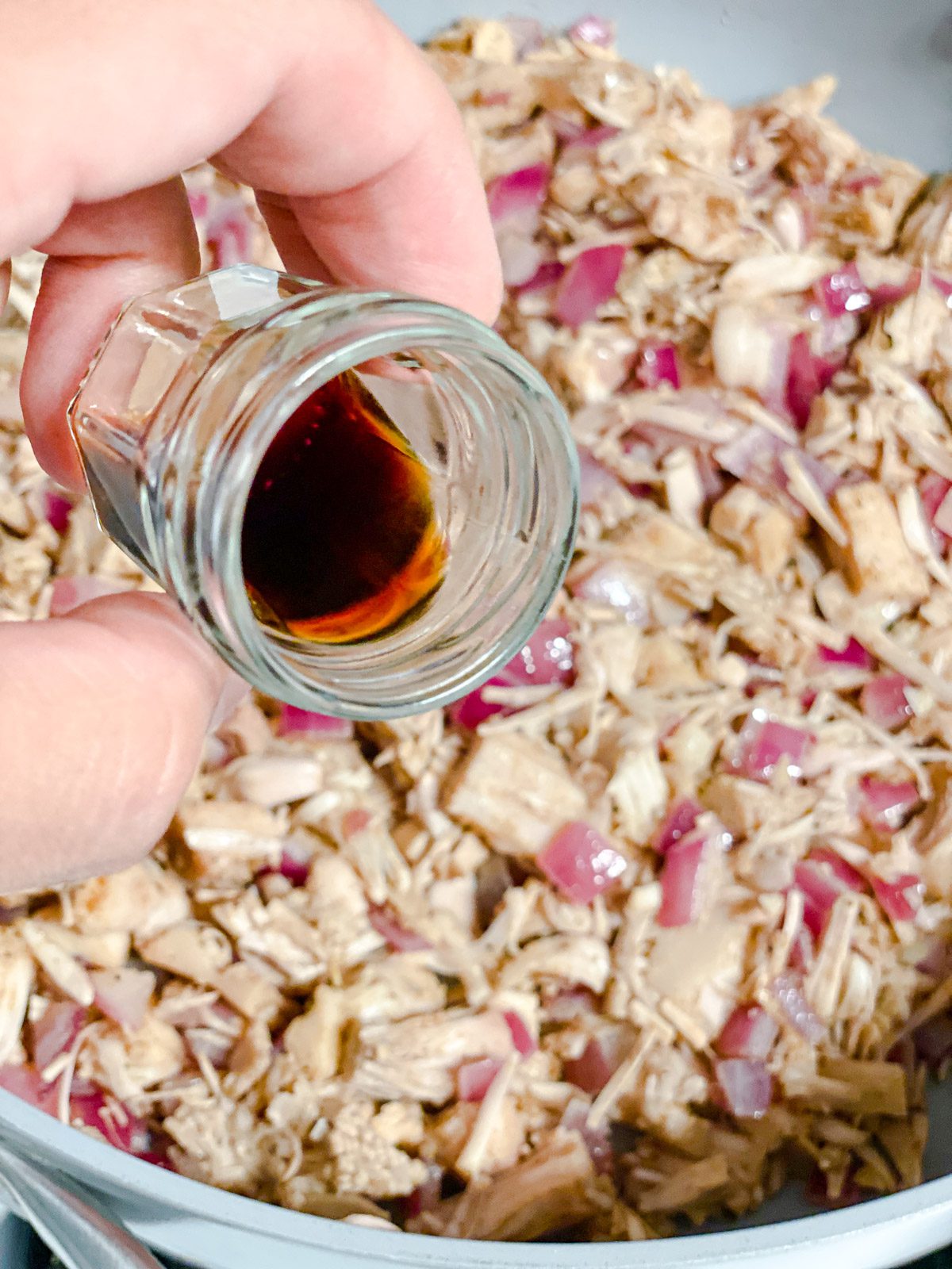 process of adding liquid smoke to pan