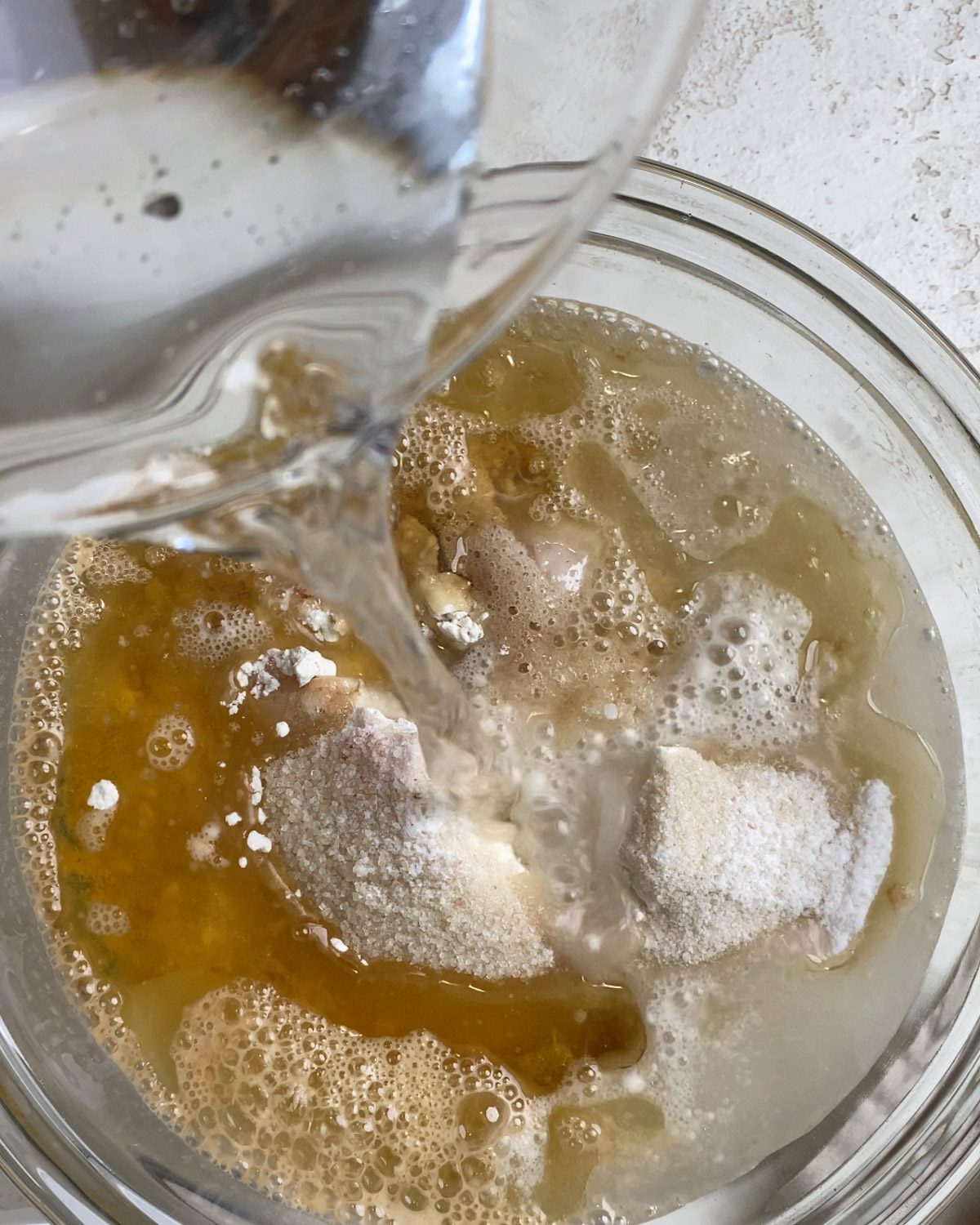 process shot of water added to glass bowl