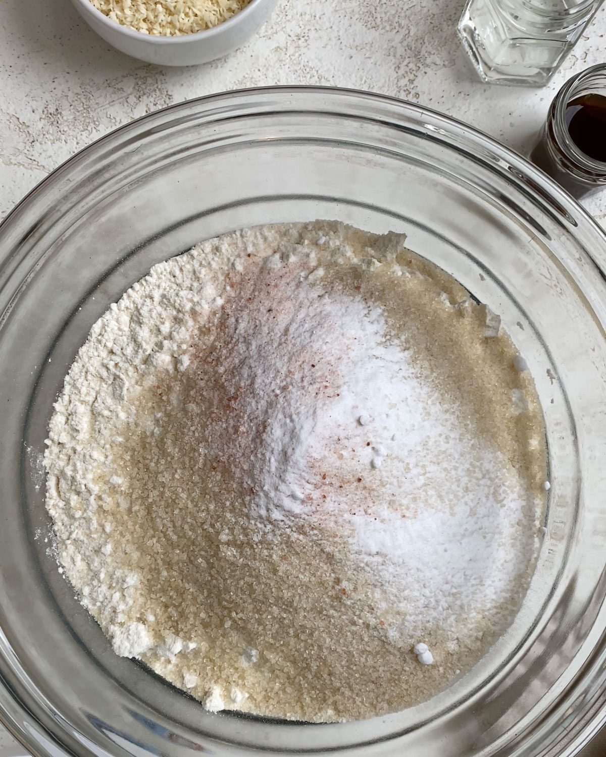 process shot of baking powder added to glass bowl