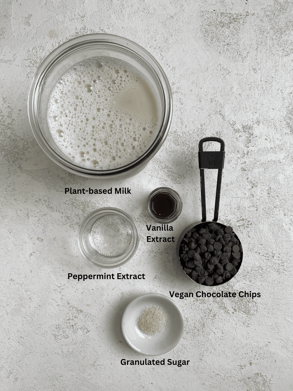 ingredients for Dairy-Free Peppermint Hot Chocolate measured out against a white surface