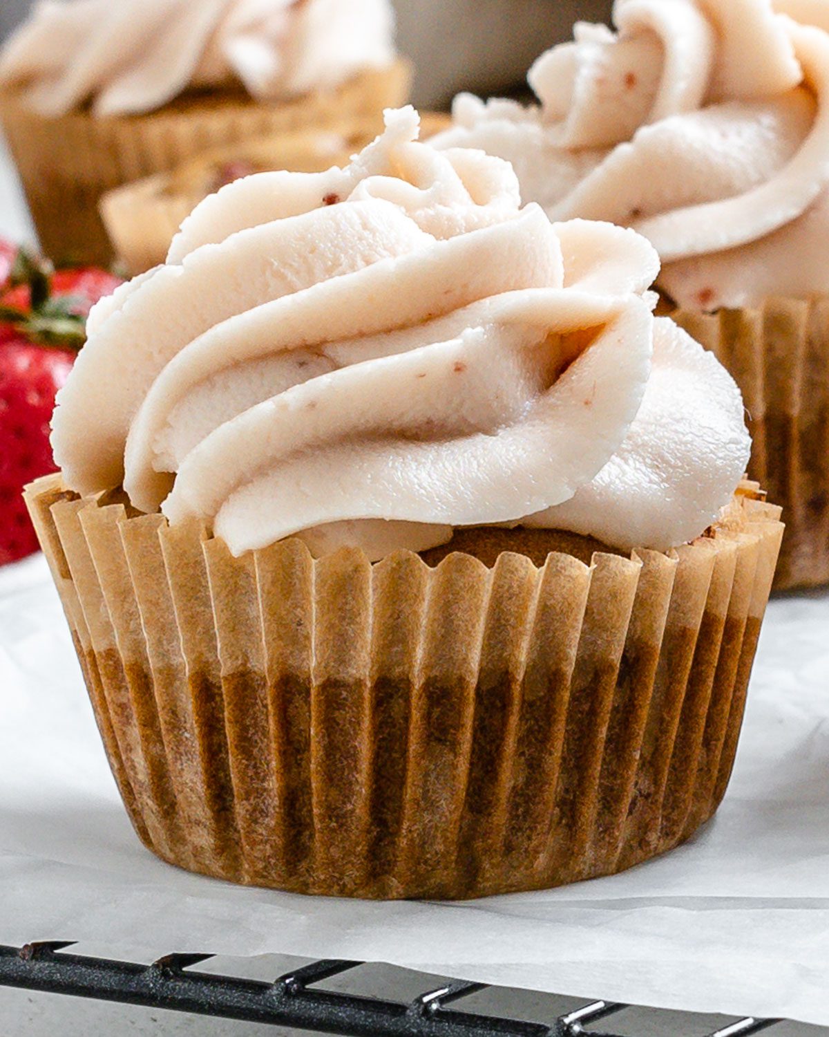 completed muffins spread out against a white surface