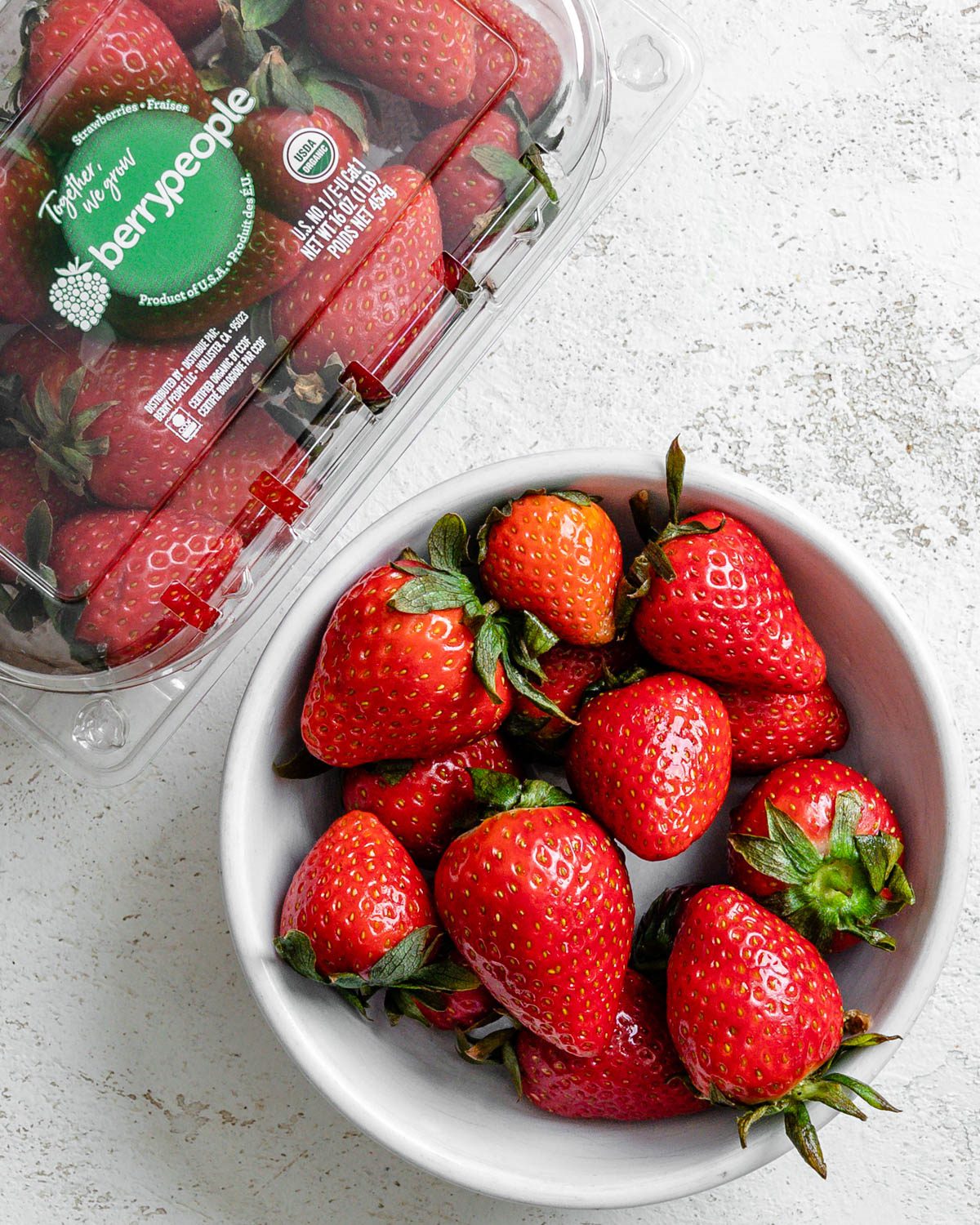 ingredients for Vegan Strawberry Cupcakes measured out against a white surface