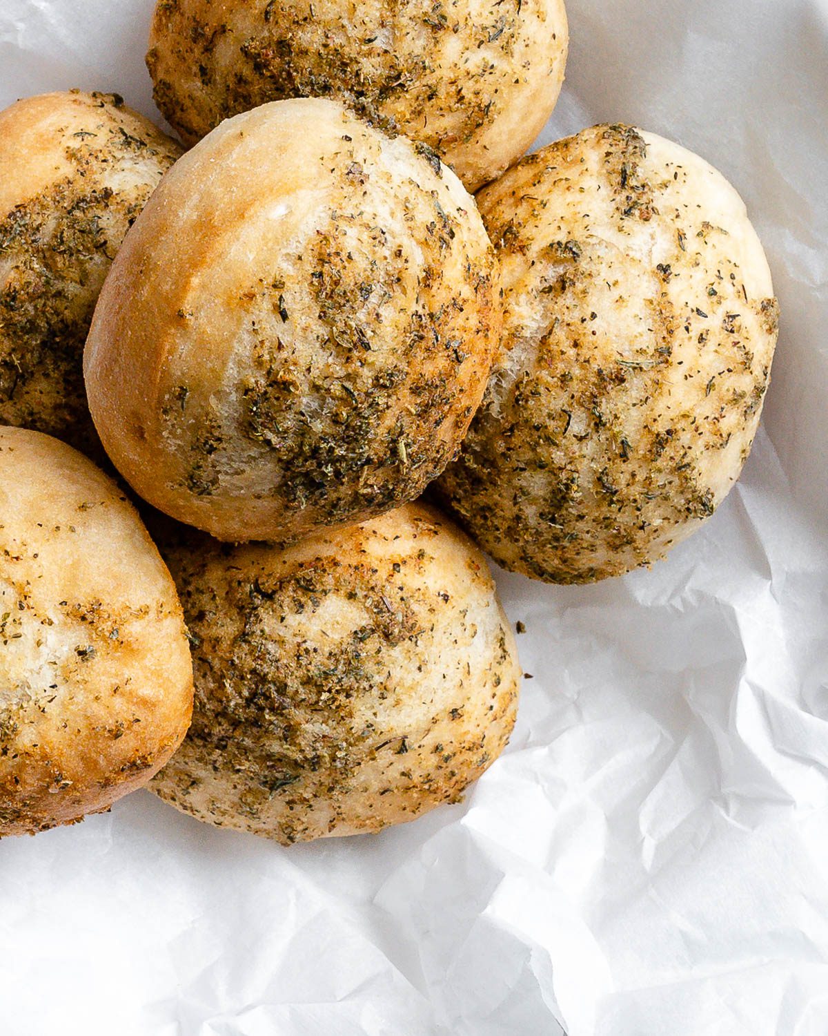 completed dinner rolls against a light background