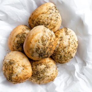 completed dinner rolls against a light background