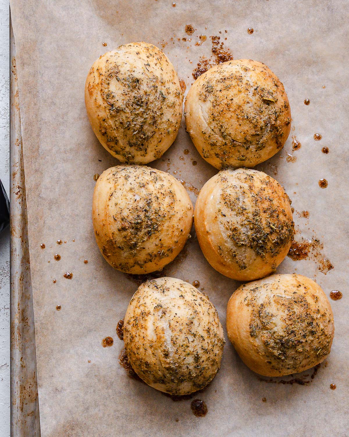 completed dinner rolls in a baking tray