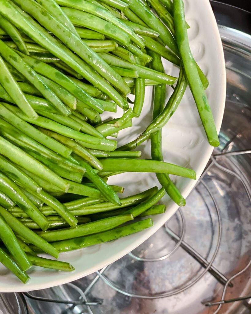 process shot of adding green beans to instant pot