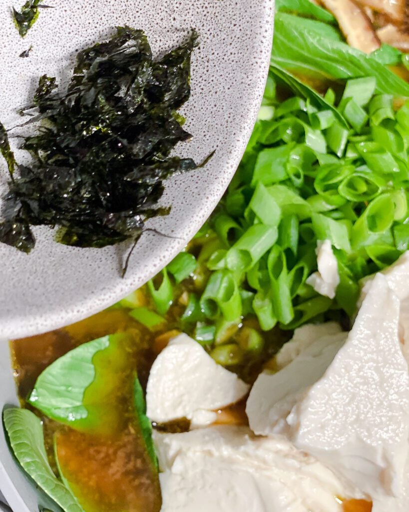 process shot if adding seaweed sheets to pan