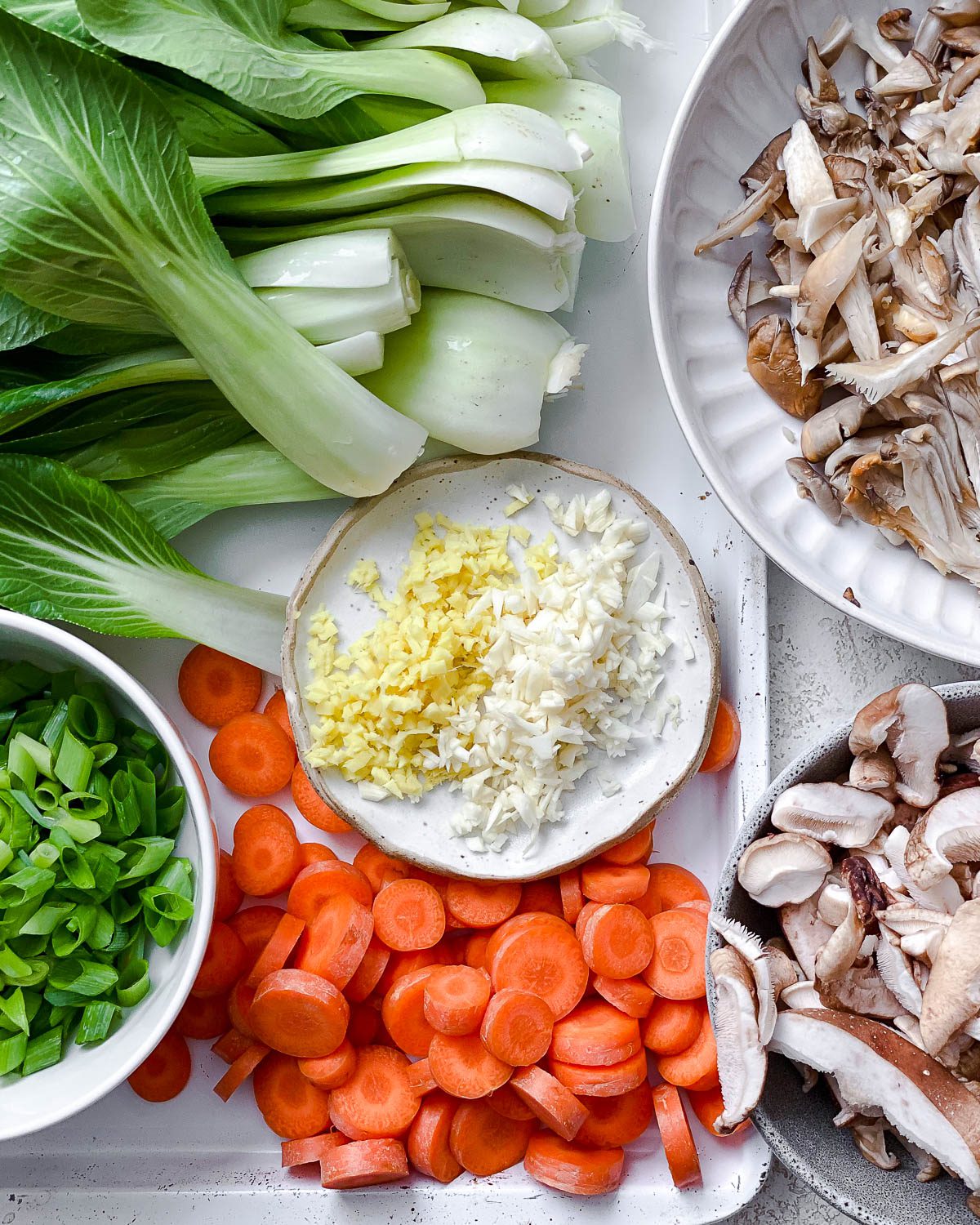 ingredients measured out for Easy Vegan Mushroom Miso Soup against a white background