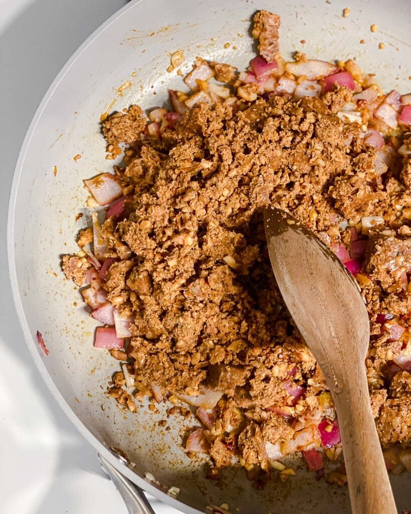 process shot of mixing in chorizo to pan