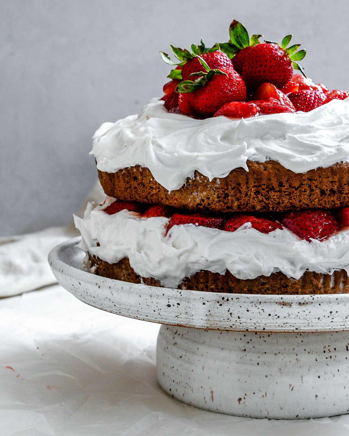 completed Vegan Strawberry Shortcake on a cake stand
