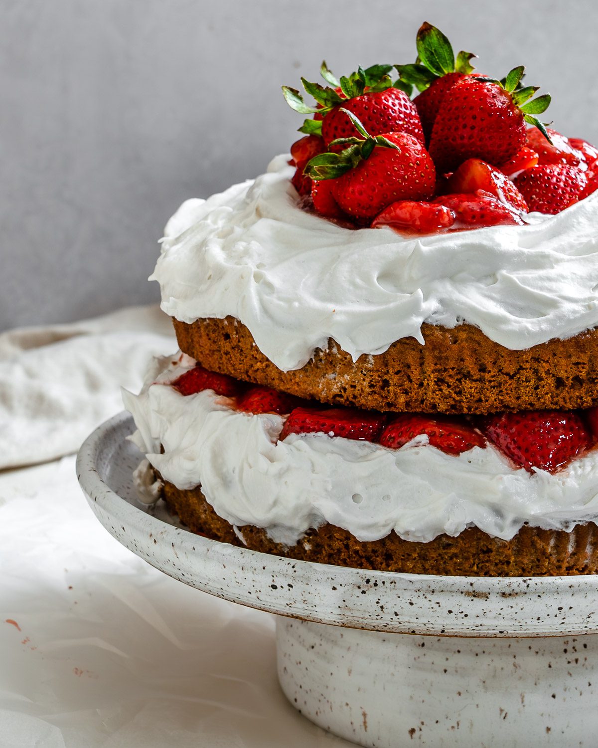 completed Vegan Strawberry Shortcake on a cake stand