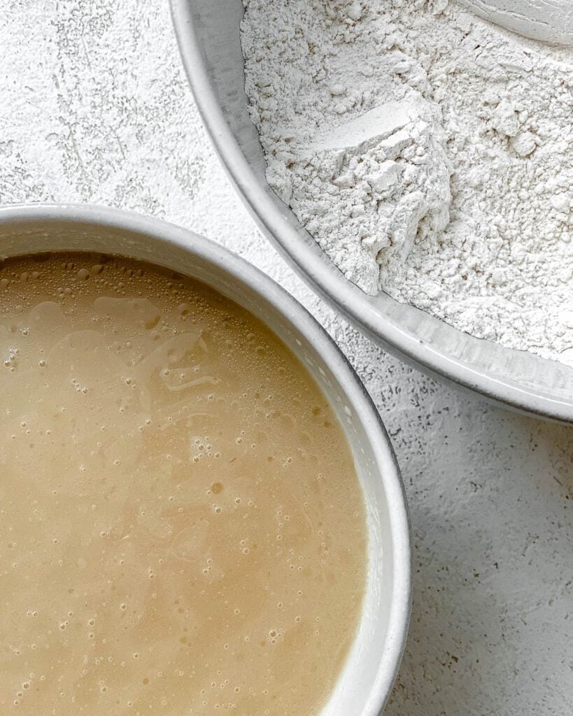 dry ingredients and wet ingredients in individual bowls alongside each other