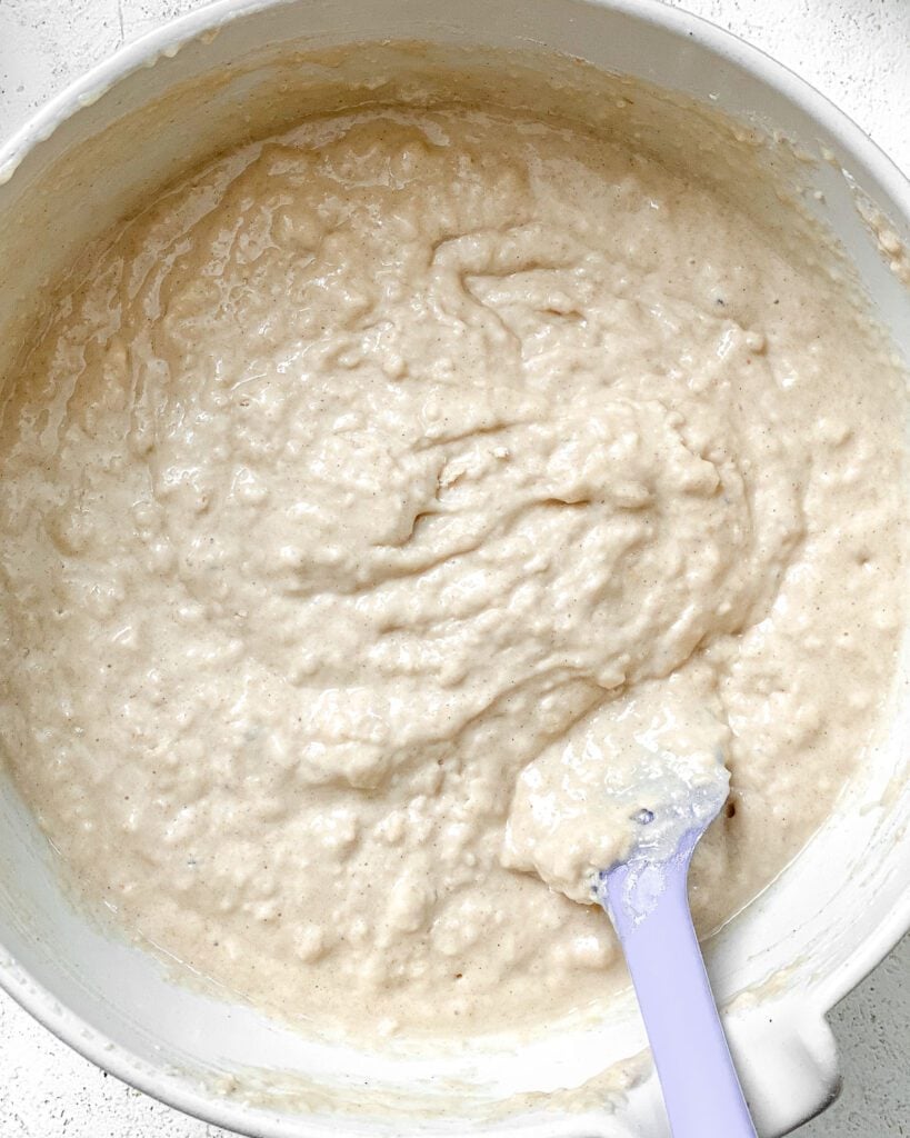 process shot of mixing ingredients together in a bowl