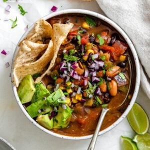 completed Easy Vegan Taco Soup in a bowl against a light surface
