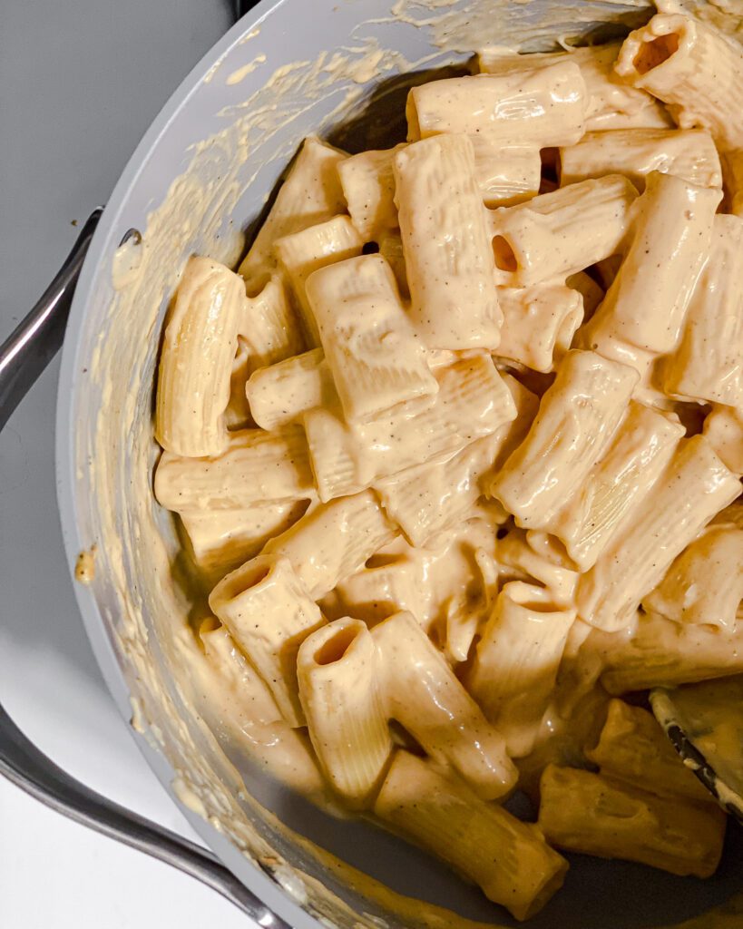 process shot of mixing pasta ingredients together