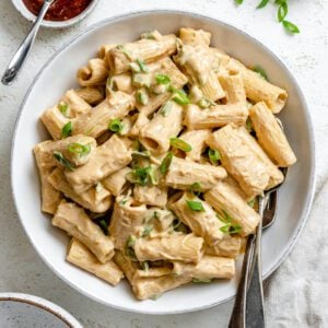 completed Creamy Gochujang Pasta plated in a white plate against a white background