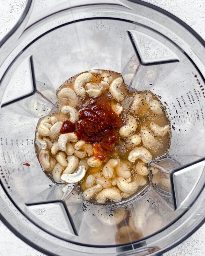 process shot of adding ingredients for Creamy Gochujang Pasta in a blender