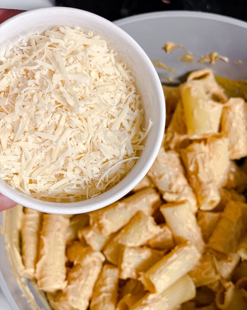 process shot of adding parmesan cheese