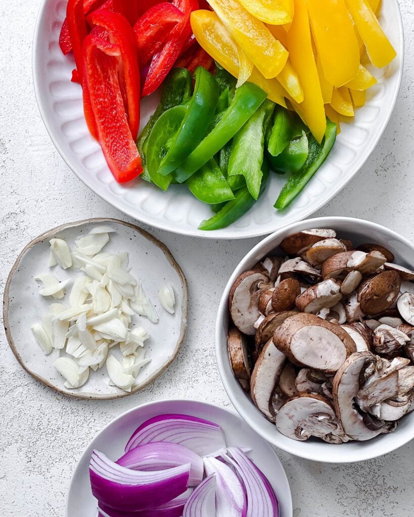 ingredients for Instant Pot Fajita Vegetables measured out against a white surface