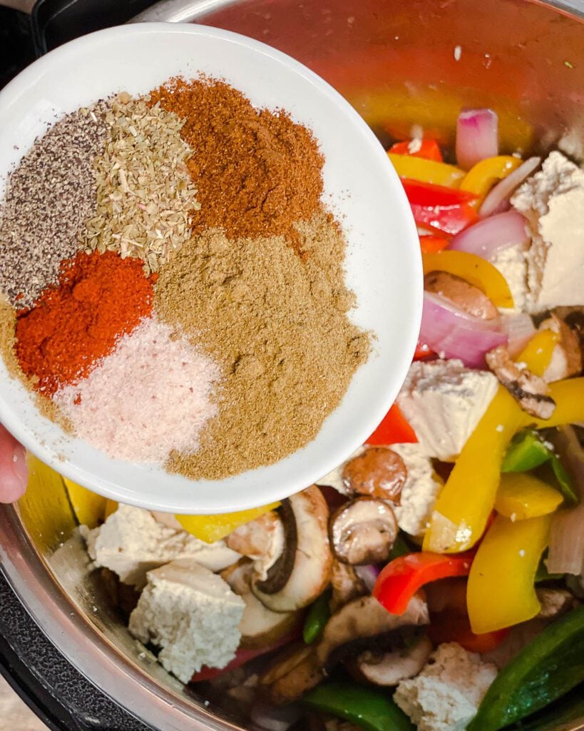 process shot of adding spices to pot