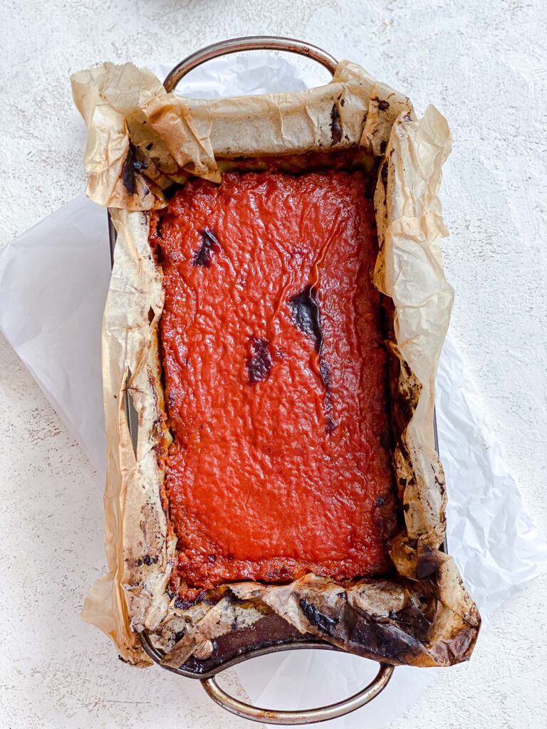 process shot showing post broiled meatloaf with sauce