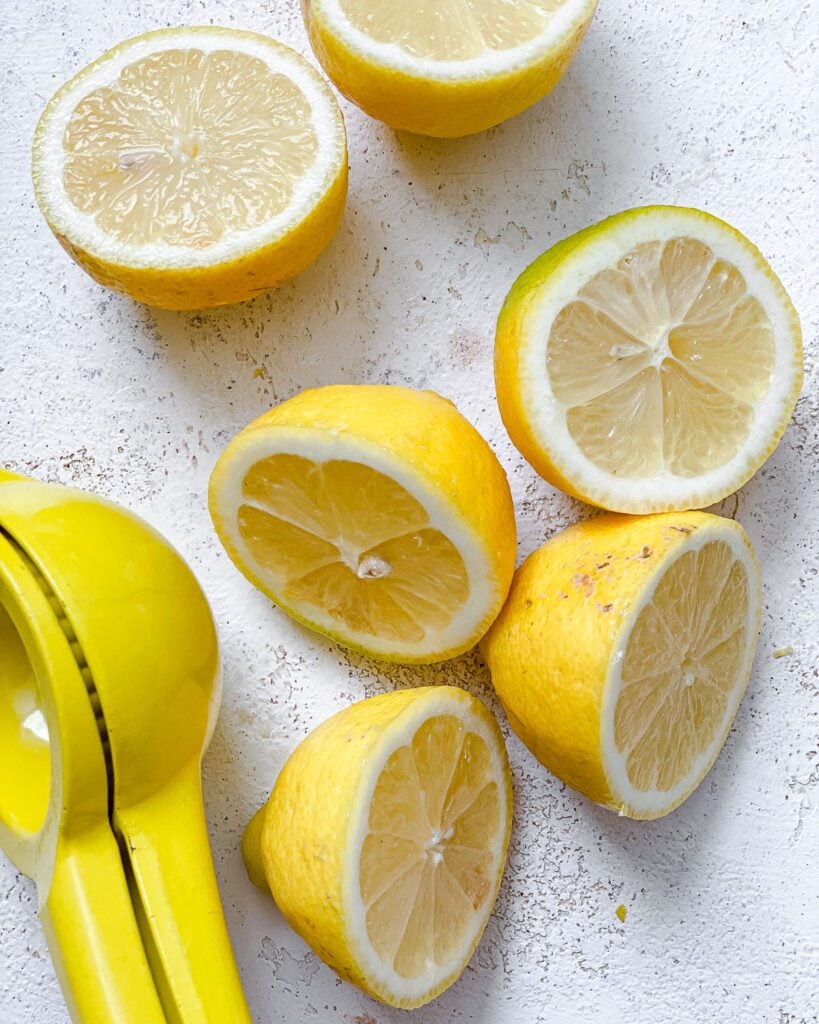 sliced lemons against a white surface