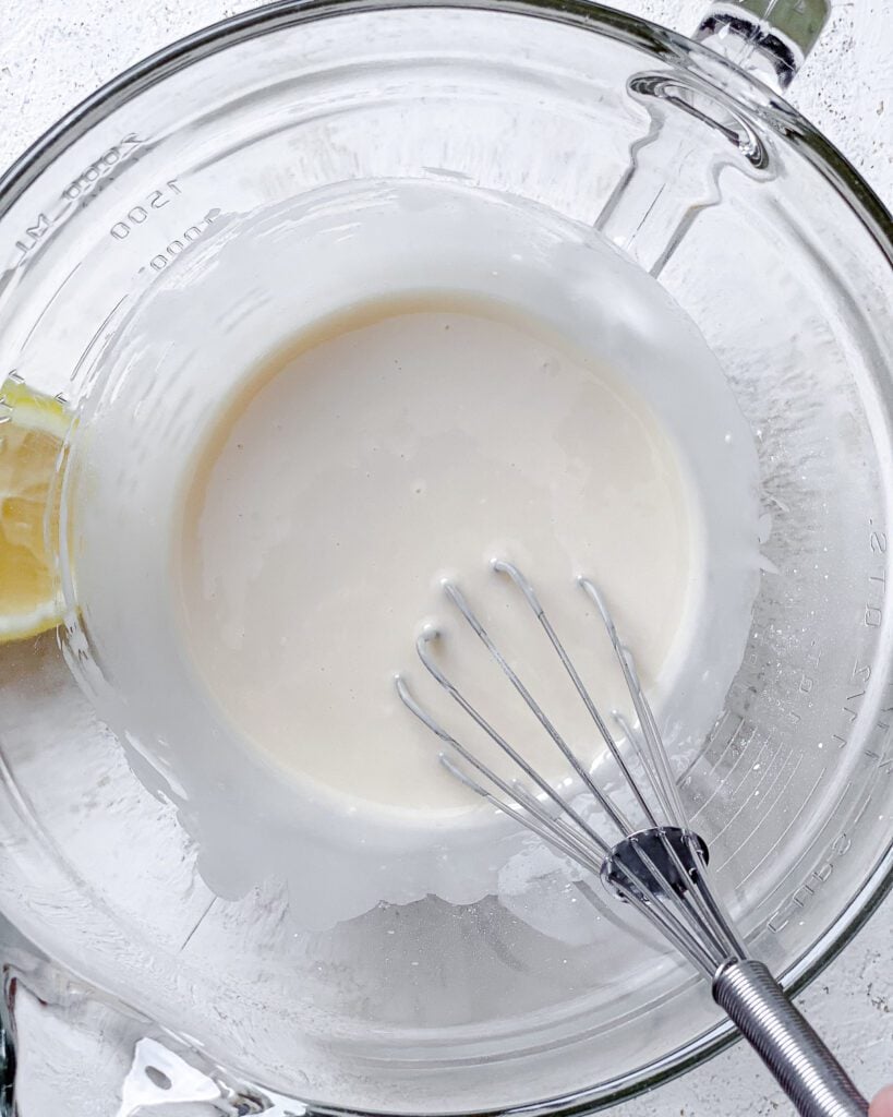 process shot of whisking ingredients together