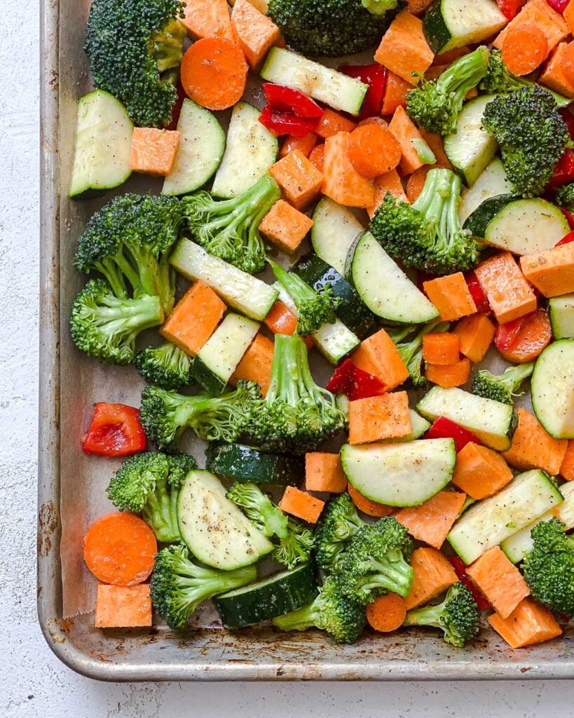 veggies added to a baking sheet