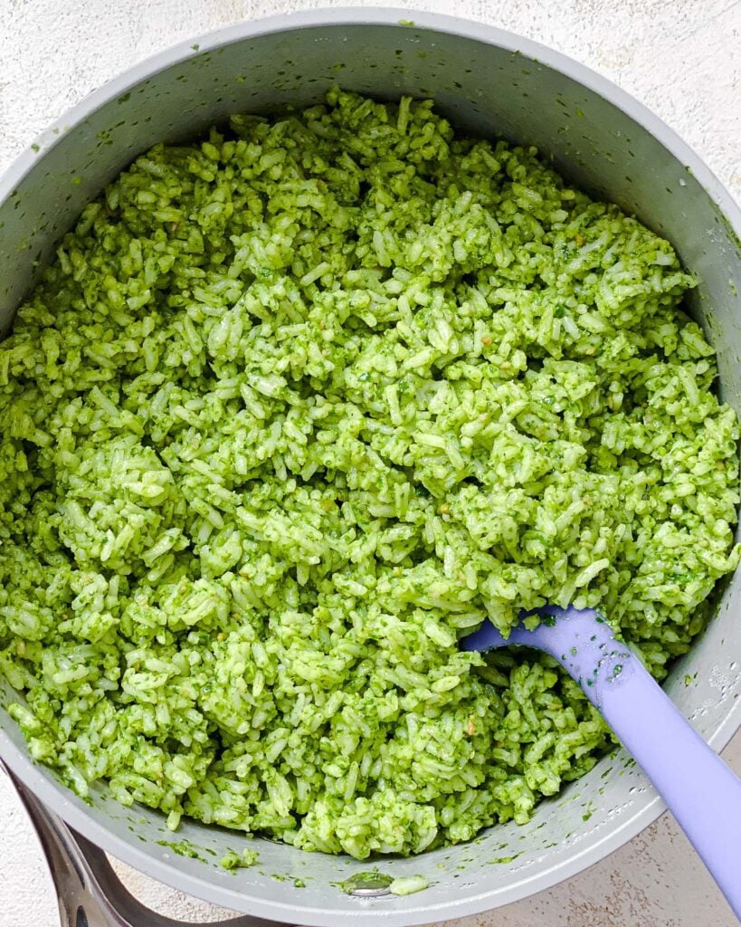 process shot oof mixing pesto ingredients with rice