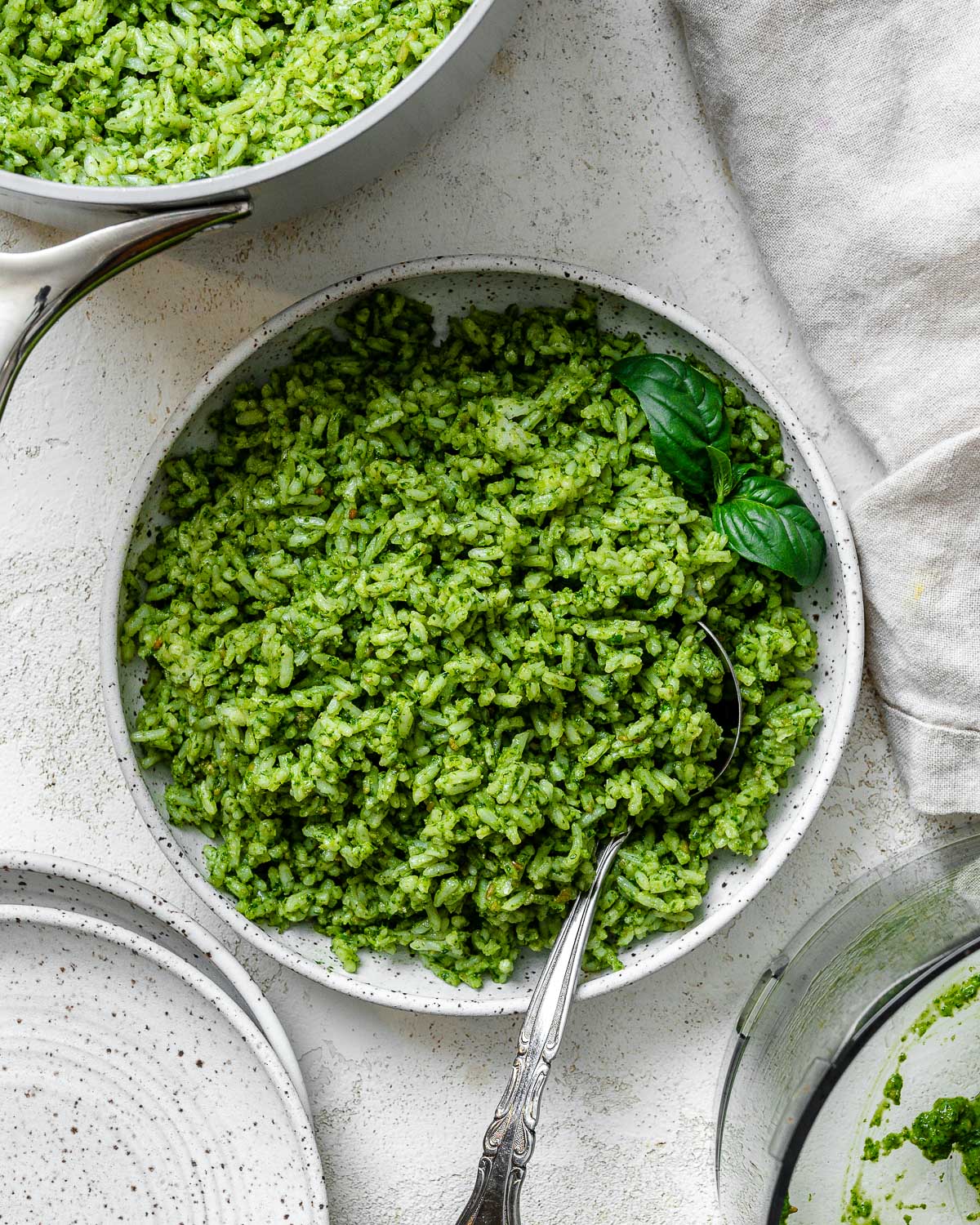 completed pesto rice against a light surface