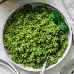 completed pesto rice against a light surface
