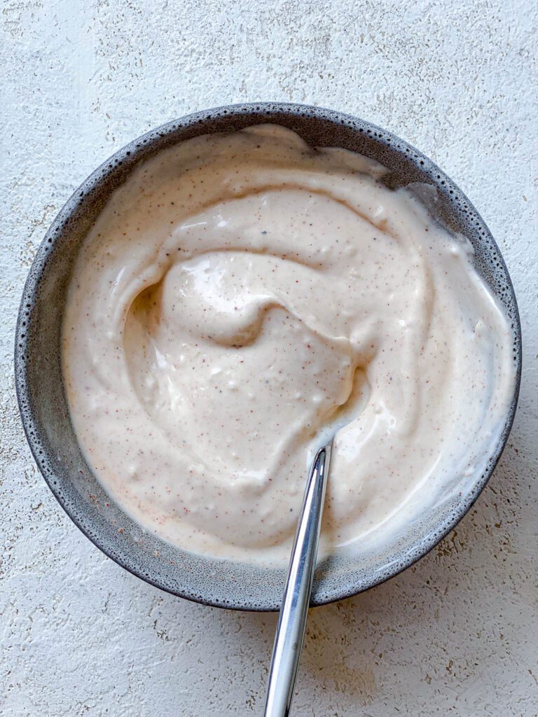 process shot showing the mixing of 5-Minute Vegan Garlic Aioli against a white background